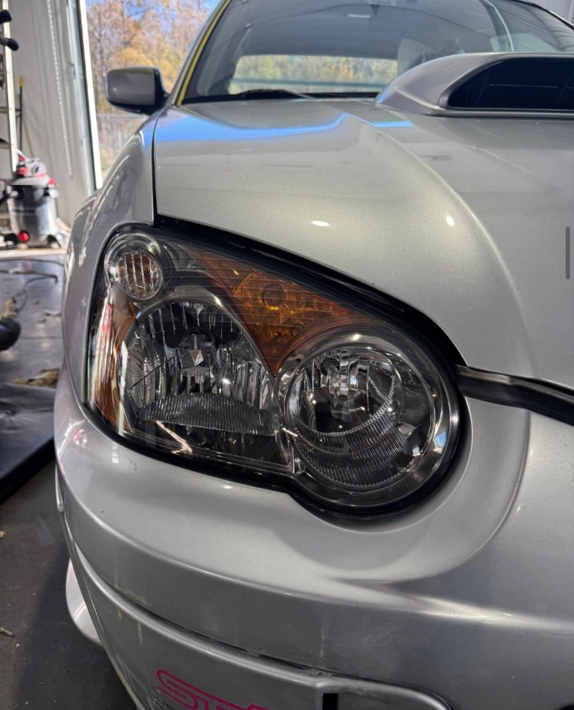Crystal clear restored headlight after UV oxidation removal and protective sealant in Clearfield Utah